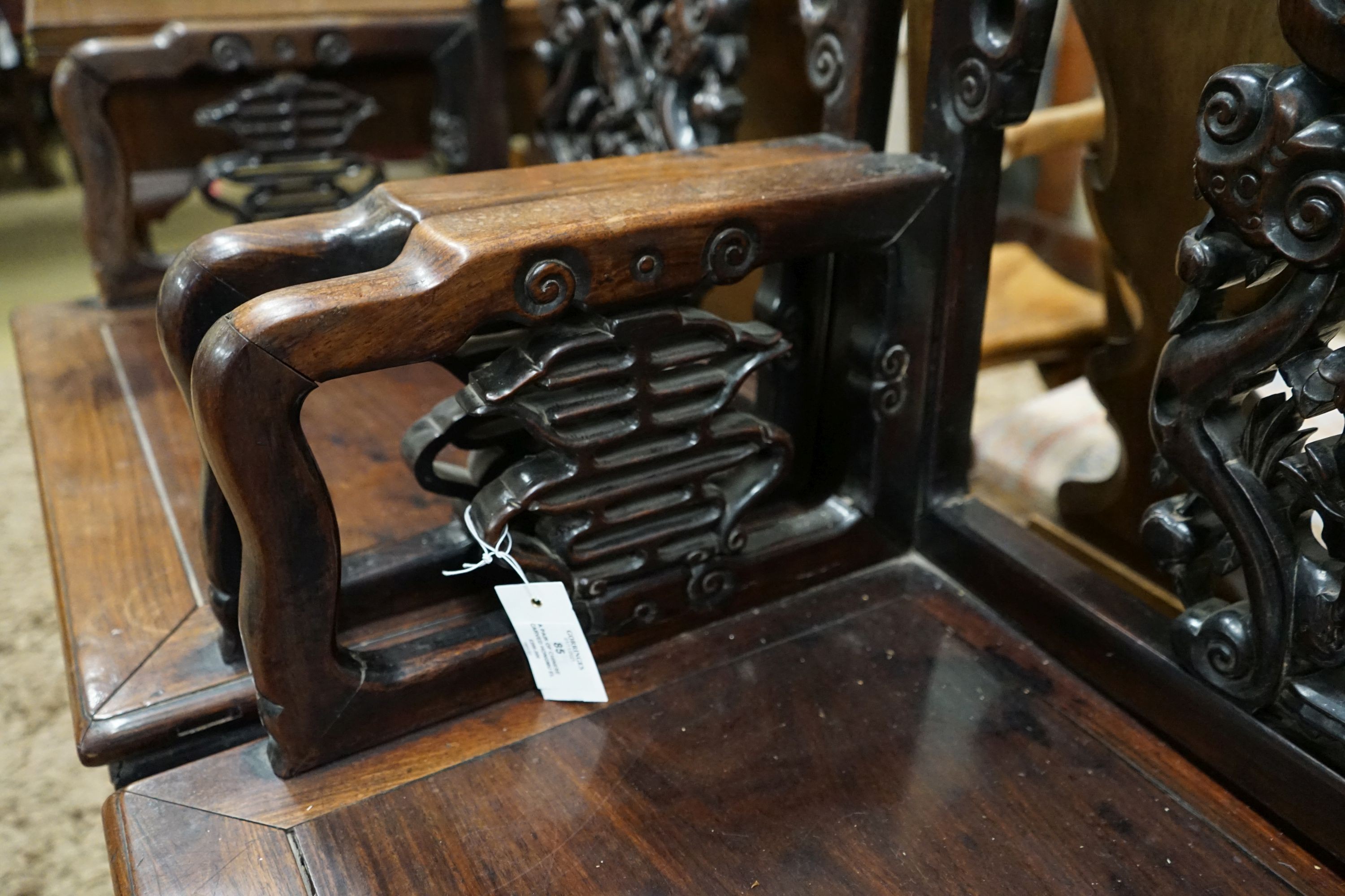 A pair of Chinese carved hongmu elbow chairs (a.f.), width 65cm, depth 48cm, height 96cm
